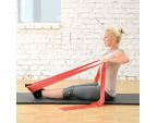 Femme en position de tirage avec la FITBAND Rouge 25m