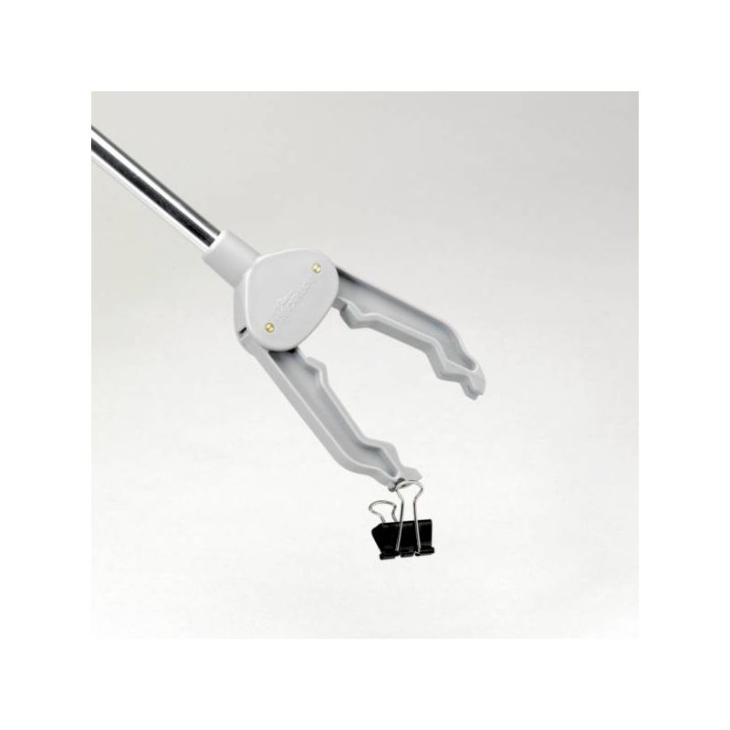 La Pince de préhension Pick-Up Homecraft® en train d'attraper un petit objet La Pince de préhension Pick-Up Homecraft® en train d'attraper un petit objet